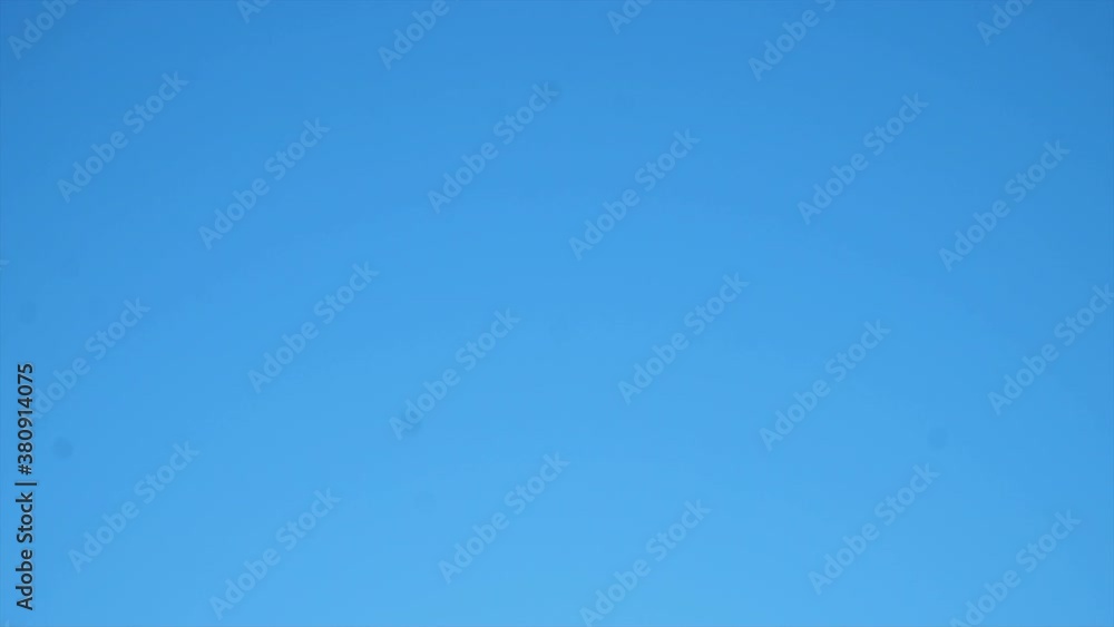 Medical transport helicopter flying through blue sky in California. Medical transport helicopter flying through blue sky in California.