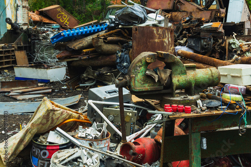 Scrap yard, metal for recycling, front background vise.