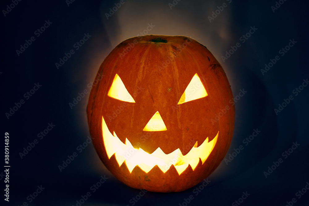halloween pumpkin with light bulb and backlit scary zigzag muzzle. hedgehog. High quality photo halloween pumpkin with light bulb and backlit scary zigzag muzzle. hedgehog. High quality photo