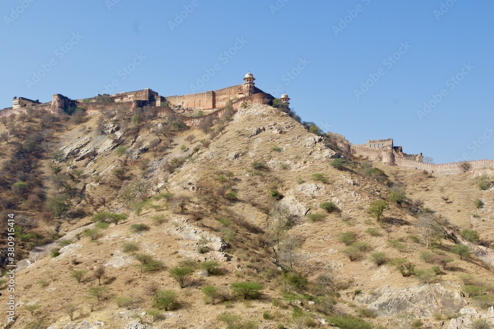 old castle in the mountains seen from Amber castle in Jaipur, Rajasthan, India 