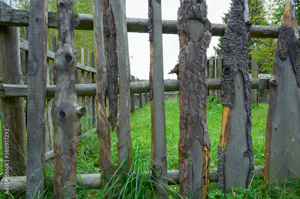 wooden ancient wattle fencing around a northern ancient russian wooden house