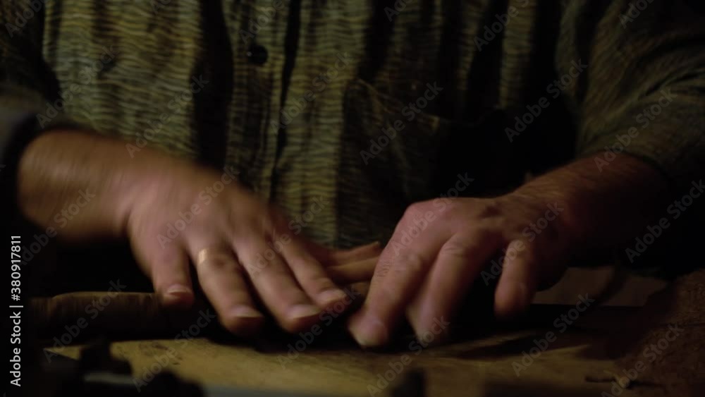Old Cuban man hand rolling cigars closeup Old Cuban man hand rolling cigars closeup