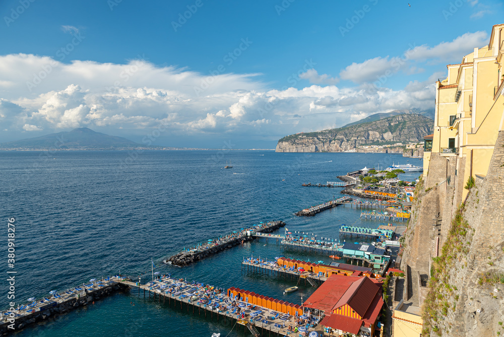 Sorrento, Italy. July 17th 2020. View on the beaches of Sorrento seen from the viewpoint of Piazza della Vittoria. In the distance, the Gulf of Naples and Mount Vesuvius.