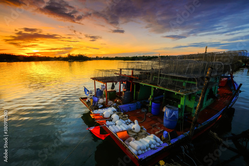 Parked fishing boat during sunset at Kuala Besut