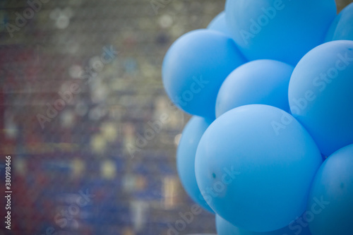 Photo zone with balloons of blue color. Selective soft focus. Birthday decor. Festive decoration. Inflatable balls on a blurred background. Childrens party background. Festive photo zone in blue. photo