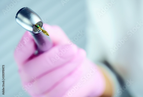 Dental tool for polishing teeth grinding. Plaque and tartar cleaning. Modern methods in dentistry. Abrasive tool of the dentist.