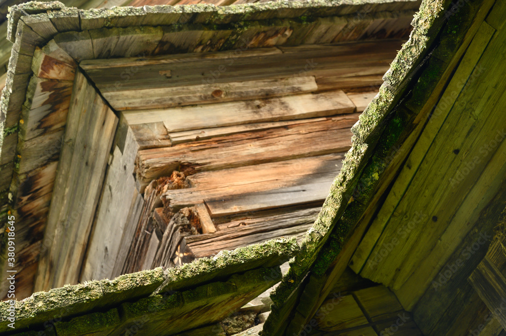Ancient northern russian wooden cabins and churches in the wood near the river Ancient northern russian wooden cabins and churches in the wood near the river