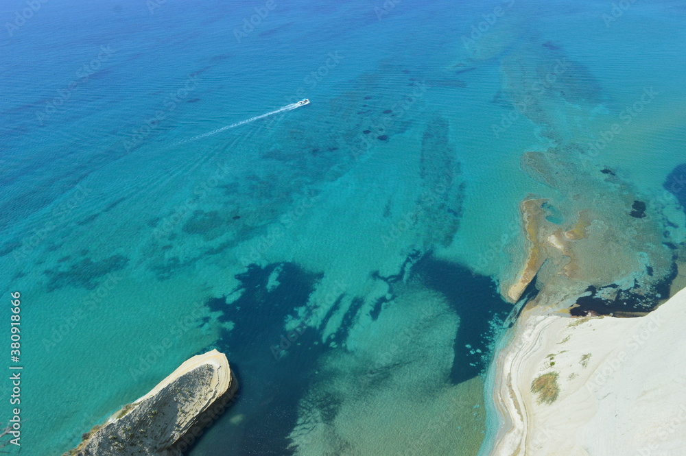 The beautiful turquoise ocean in the Ionian Sea surrounding the island of Corfu, Greece