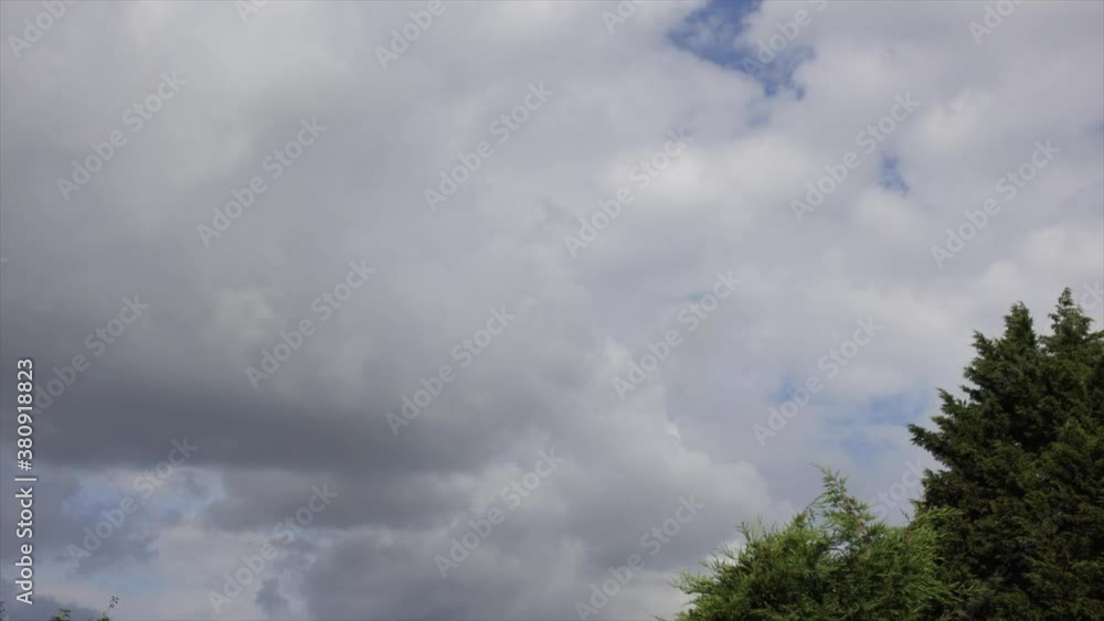 Puffy white clouds moving across the sky Puffy white clouds moving across the sky