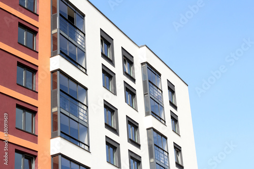 Close view of Russia skyscrapper with windows, blue sky background