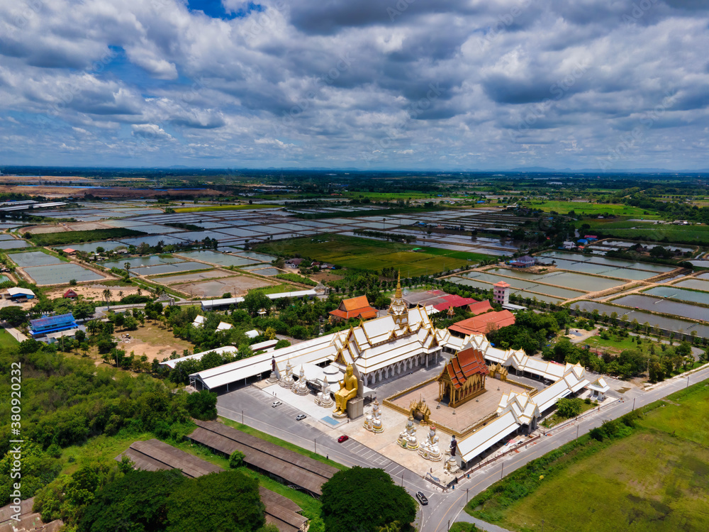 Nakhon Pathom / Thailand / August 09,2020 : Wat Charoen Rat Bamrung. The temple is very beautiful, the whole church And the Buddha statue in front of the magnificent temple