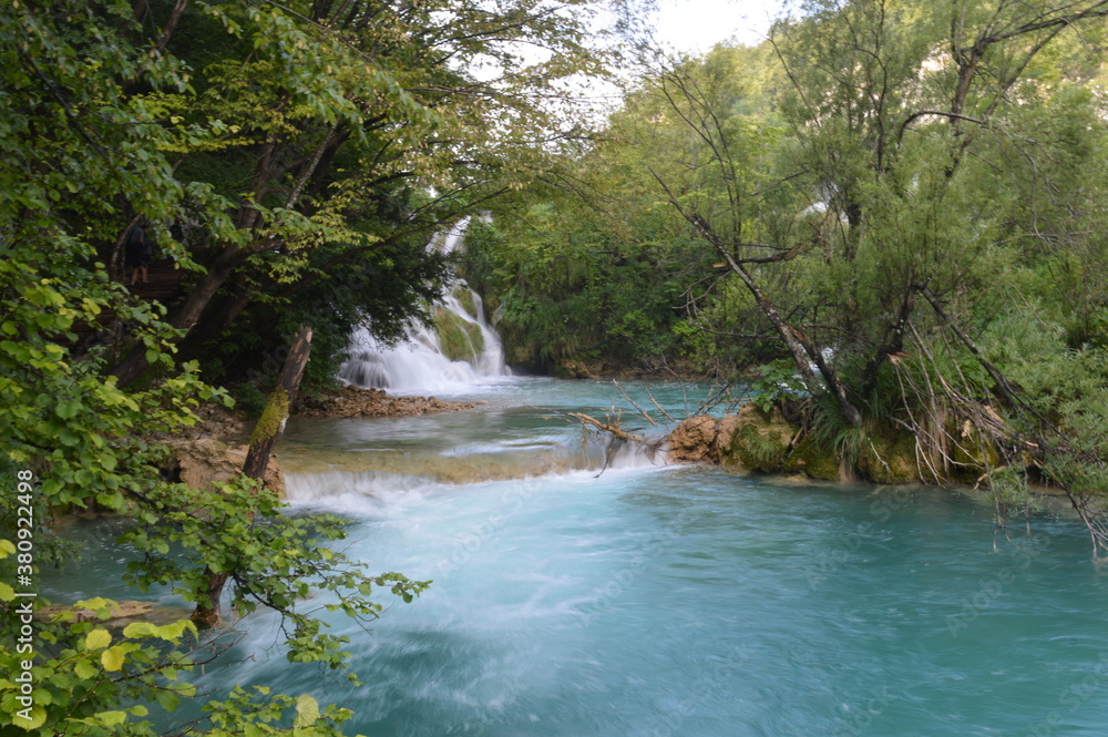 Fototapeta premium The pathways around the turquoise clear water in the Plitvice Lakes National Park in Croatia