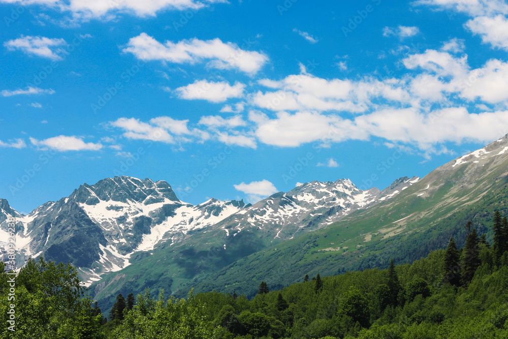 Caucasus Mountains Under Snow And Blue Sky