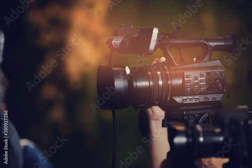 videographer close up, cameraman, movie, man with camera, movie, professional camera 