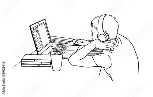 Boy at the desk is learning online. Distance learning. Vector hand drawn illustration on white background. Black and white drawing.