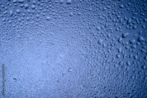  water drops on glass on blue background