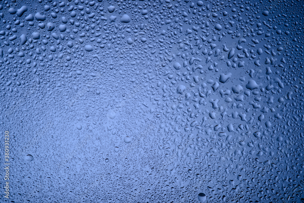 water drops on glass on blue background2
water drops on glass on blue background2