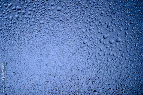  water drops on glass on blue background2