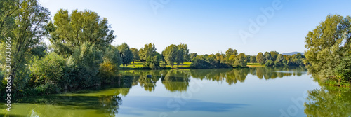 Beautiful panorama of the lake landscape on a summer day in the Fuldaaue in Kassel, Germany