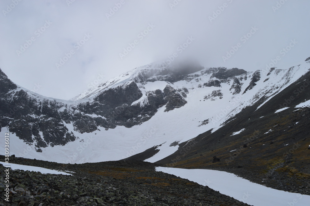 Fototapeta premium Hiking and climbing Kebnekaise, Sweden's highest peak, in Lapland