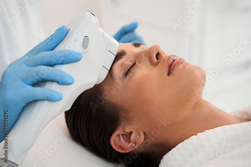 Woman receiving anti aging hardware procedure