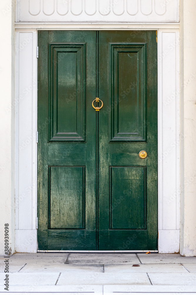 Wooden front door with dark green paint