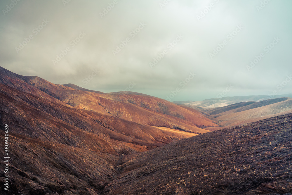 Fototapeta premium Mountain landscape view from Astronomical viewpoint Sicasumbre (Mirador Astronomico De Sica Sumbre). Fuerteventura. Canary Islands. Spain. Stylization. Toning.