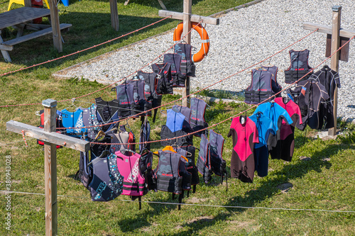 Clothes for water sports activities are dried by the lake