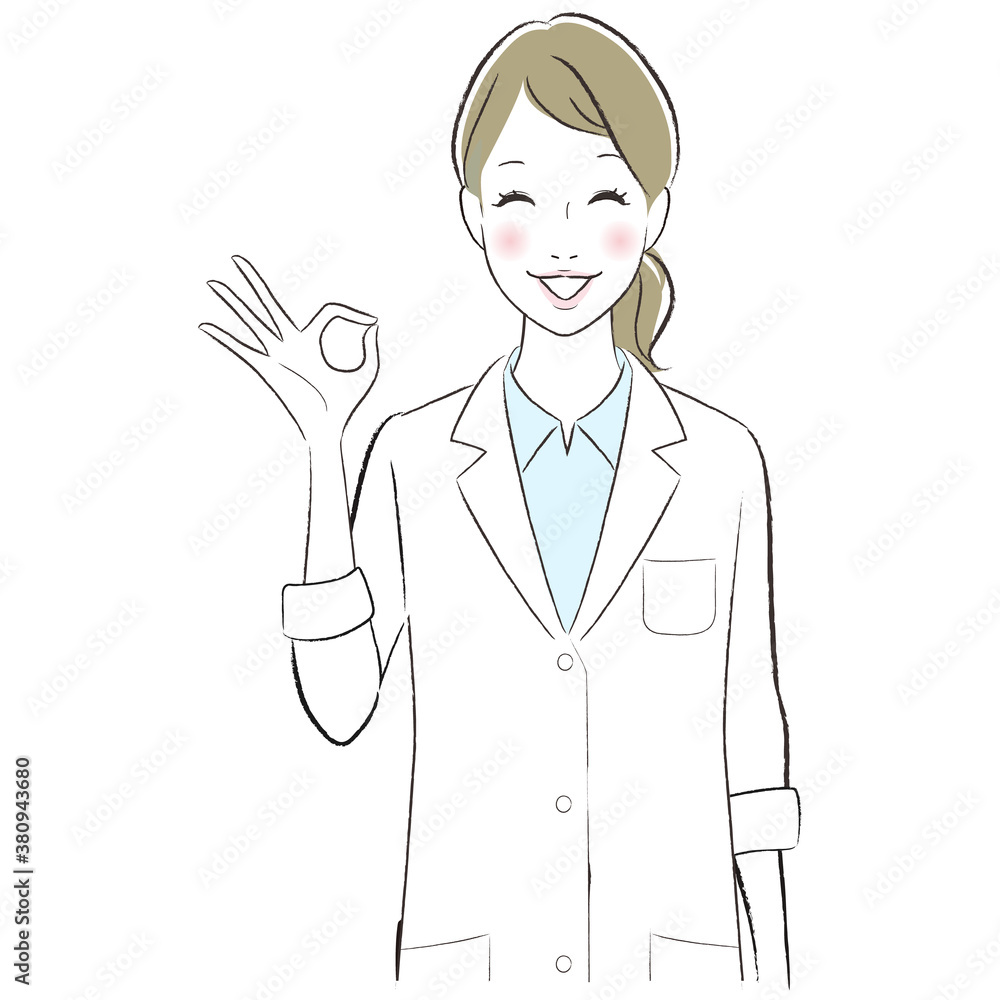 A female doctor wearing lab coat smiling showing ok sign A female doctor wearing lab coat smiling showing ok sign