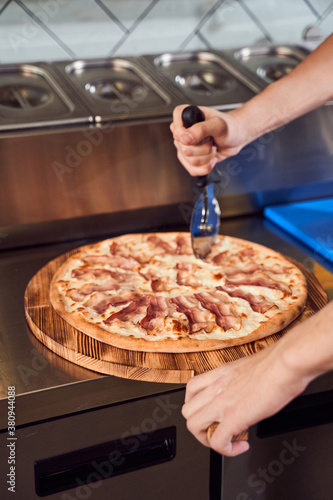 Close up cutting italian pizza