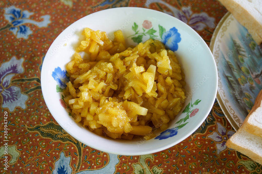 Homemade pineapple jam in a bowl on tablecloth Homemade pineapple jam in a bowl on tablecloth