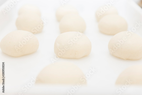Traditional Italian cuisine: chef prepares pizza dough with water and flour. food photography for menus and websites