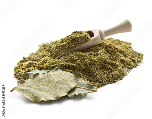 Bay leaf and crushed bay leaves isolated on white background photo