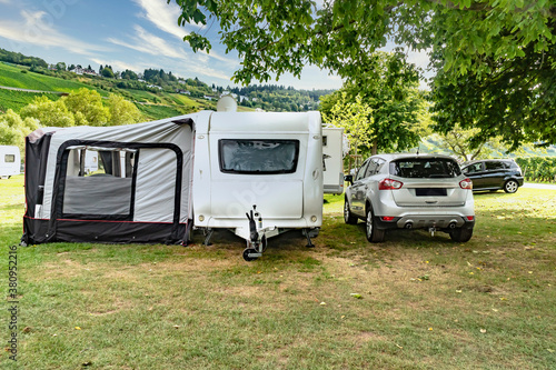 Caravan with car on campsite
