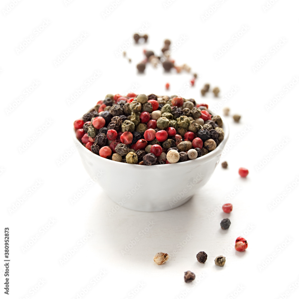 Peppercorn mix in bowl on the white background Peppercorn mix in bowl on the white background