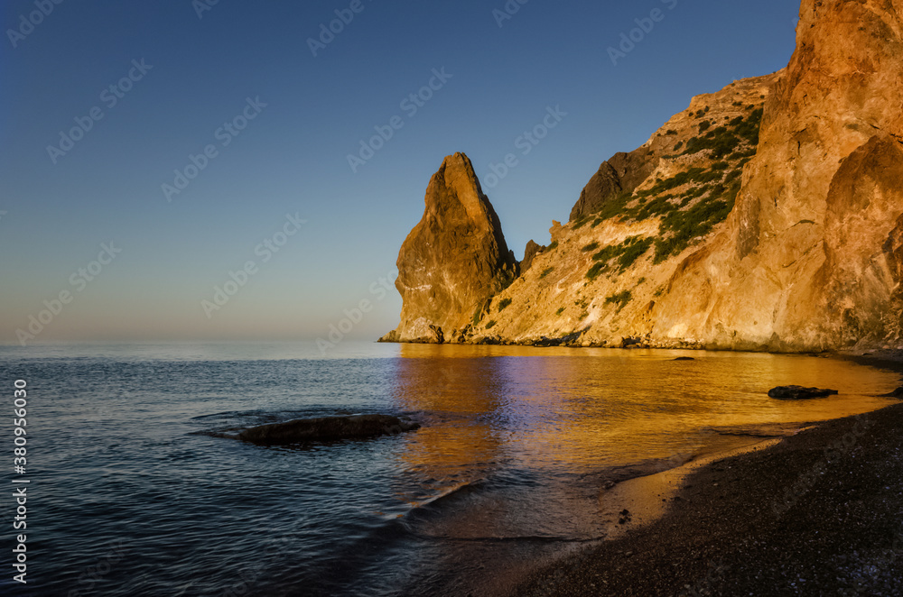 Dawn on the sea, the sun shines on the rock, Crimea.