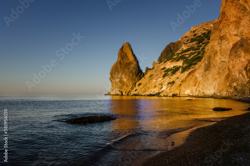 Dawn on the sea, the sun shines on the rock, Crimea.
