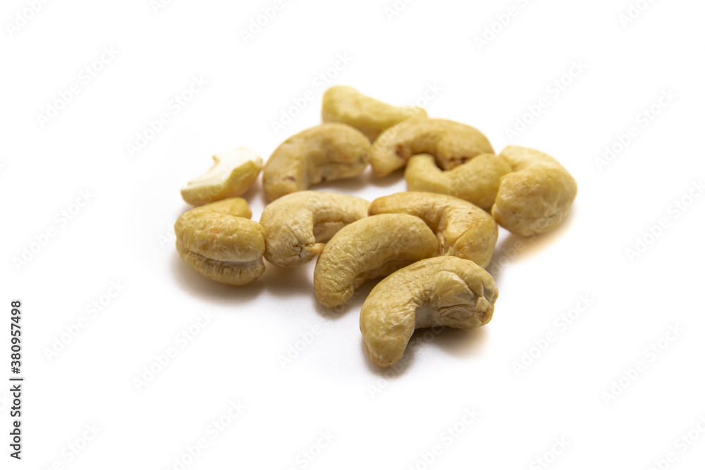 Large pile of cashew nuts on white isolated background macro photo Large pile of cashew nuts on white isolated background macro photo