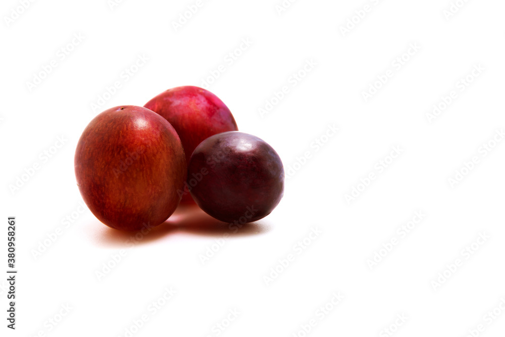 Still life of red grapes several pieces on white isolated background