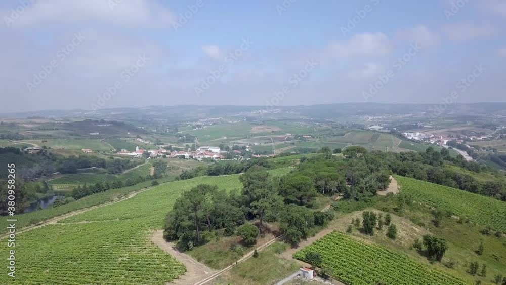 Drone flying over the plains in a the rural area of Alenquer, Portugal. Fields and crops as far as the horizon with little to no buildings in sight. Drone flying over the plains in a the rural area of Alenquer, Portugal. Fields and crops as far as the horizon with little to no buildings in sight.