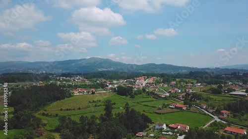 Drone flying over the country side of Alenquer, Portugal. A quiet town with fields of crops and surrounded by nature with a scenic view of the hills and mountains away from the busy city life. photo