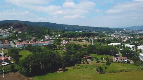 Drone flying over a town in Alenquer, Portugal. A small town away from the big bustling city, simple peaceful and quiet life among the green hills, plains and mountains. photo