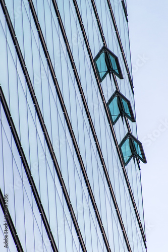 office building with three open windows