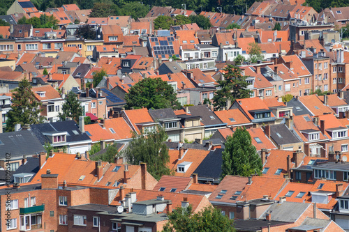 Red rooftops of residential buildings seen from above in a big city