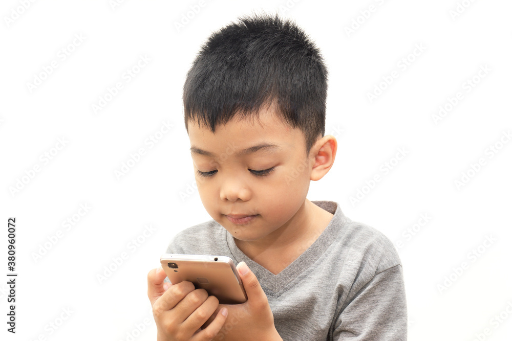 Portraits of asian boy with playing smartphone on white background, Happy time Portraits of asian boy with playing smartphone on white background, Happy time
