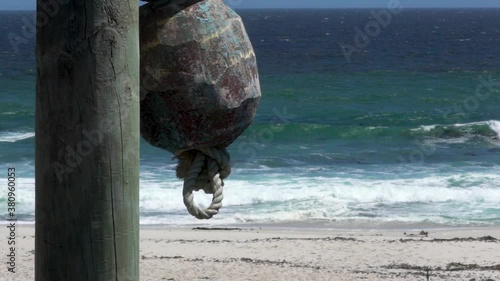 An old buoy swaying in a breeze in the little town of Lambertsbay. This town can be found on the West coast of South Africa. photo