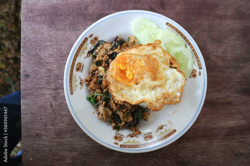 stir fried pork with chili paste, holy basil and fried egg stir fried pork with chili paste, holy basil and fried egg