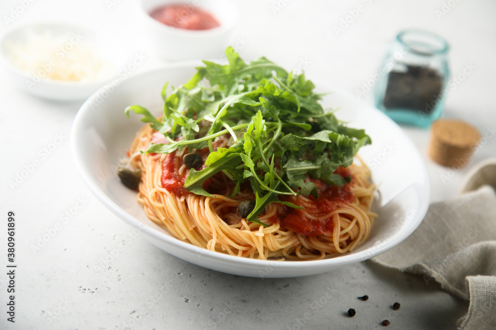 Pasta with tomato sauce, capers and arugula Pasta with tomato sauce, capers and arugula