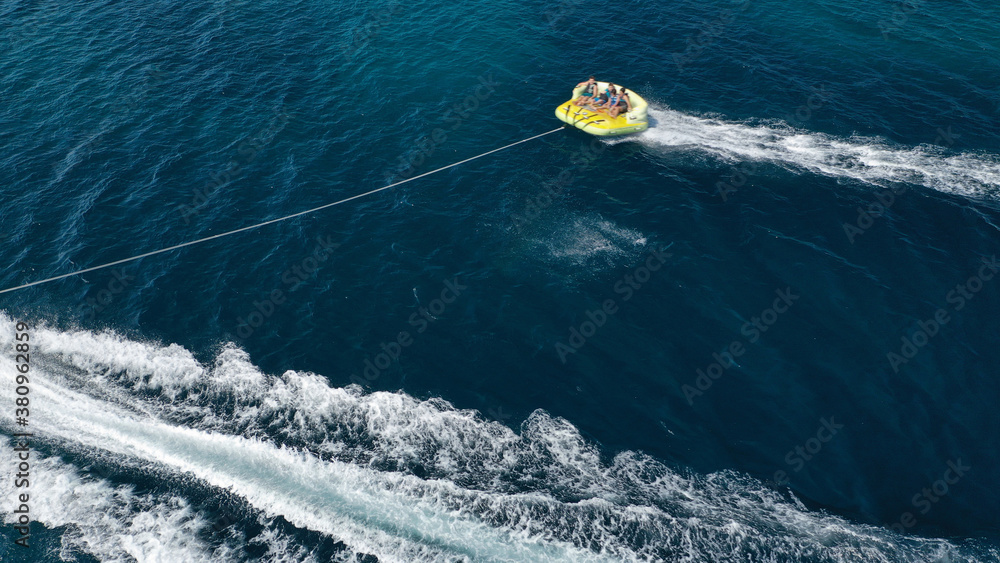 Naklejka premium Aerial drone photo of extreme powerboat donut water-sports cruising in high speed in tropical exotic island bay