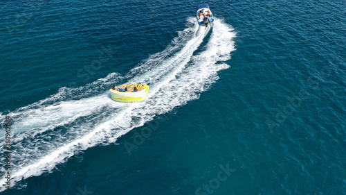 Aerial drone photo of extreme powerboat donut water-sports cruising in high speed in tropical exotic island bay © aerial-drone